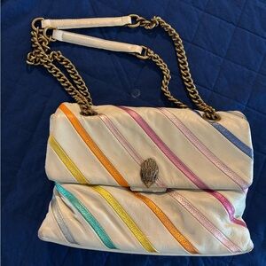Large sized Kurt Geiger white leather purse with rainbow stripes.